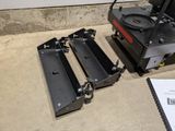 a small machine that is sitting on the floor next to another machine