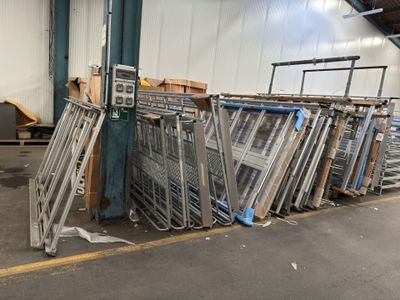many carts that are lined up in a warehouse