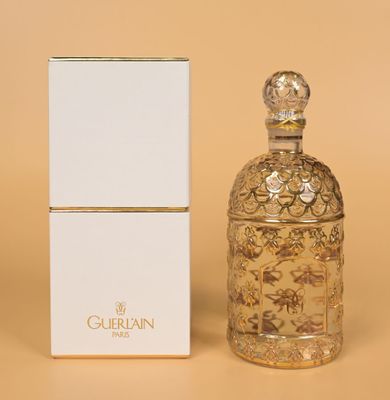 perfume bottle and box on a beige background