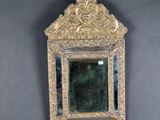 a mirror hanging on the wall in the room