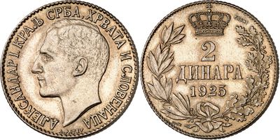 a silver coin with a crown on top of it