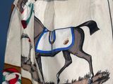 an image of a man wearing a jacket with a horse on it