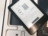 a kindle that is in the box with the box open