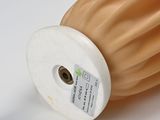 a close up of a roll of fabric on a white surface