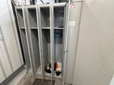 a metal locker in the corner of a room