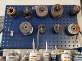a blue pegboard with many different types of tools on it