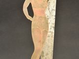 an image of a wooden sculpture of a woman holding a knife
