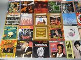many different types of music cds on the table