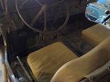 a car with a steering wheel and a seat in the back