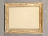 an old picture frame with a white background and gold trim