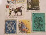 four different stamps on a piece of paper on a table