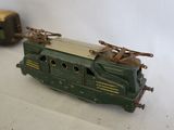 two toy trains sitting next to each other on a table