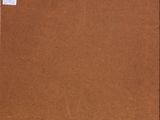 a brown cardboard box with a green sticker on it