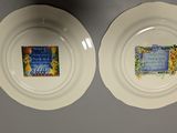 two plates with a picture on them on the wall
