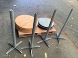 a stack of metal poles and a wooden plate on a pallet