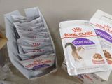 a box of cat food next to a package of cat food