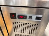 a stainless steel oven with a digital display on the door