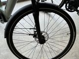 a close up of a bicycle parked in front of a window