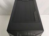 a black desktop computer sitting on a white surface