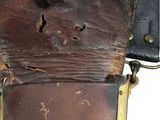 an old suitcase that has been left on the ground