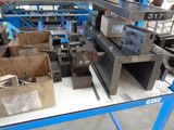 a table with a bunch of metal items on it