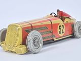 a red and yellow toy car on a white surface