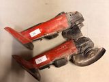 pair of red and black pipe cutters sitting on top of a table
