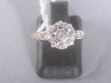 an image of a diamond ring on a black ring holder
