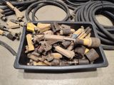 a black container filled with tools on the floor
