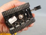 a person holding a small black object in their hand