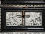 a black and white picture of a chest of drawers
