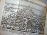 an old book with a drawing of a garden in it