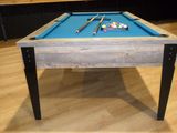 a pool table with a blue cloth on it