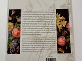 the back cover of a book with a picture of flowers on it