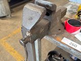 an image of a vise on a workbench in a workshop