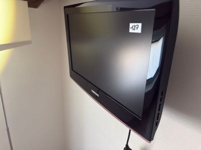 a flat screen tv mounted on a wall in a room