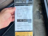 a person that is holding up a ticket for a bus
