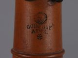 a close up of a brown vase with a black lid