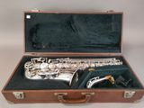 a saxophone that is in a case on a table