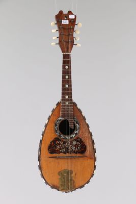 a guitar hanging from the ceiling in a room