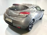 a silver car that is parked in a white room