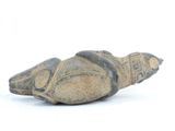 a small statue of a shoe on a white surface