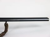 a close up of a rifle on a stand with a white background