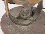 a close up of a metal object with a clock on it