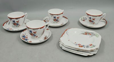 five cups and a saucer on the table