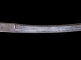 a close up of a knife on a black background