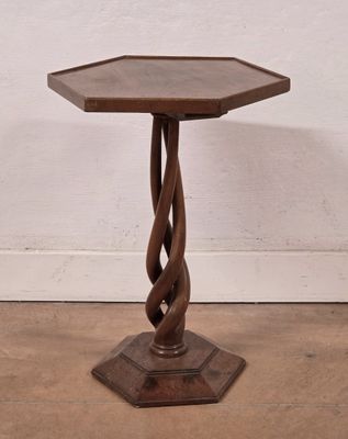 an image of a small wooden table with a spiral design