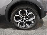 a close up view of a car ' s wheel on the floor