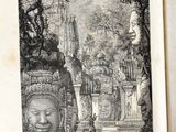 an old book with a drawing of a face on it