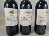 three bottles of wine sitting next to each other on a table